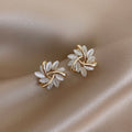 Elegant Breeze Opal Earrings featuring a delicate floral design, showcasing shimmering opal stones set in high-quality metal for a sophisticated look. - 1