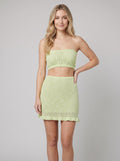 Kaia Beach Knit Set in lime - crochet knit bandeau top and mini skirt, front view