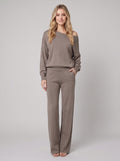 Luxe Eleganza loungewear set in camel taupe, off-shoulder knit sweater and wide-leg pants, front view on model