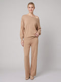 Luxe Eleganza loungewear set in khaki tan, off-shoulder knit sweater and wide-leg pants on model