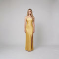 Mira yellow satin open-back maxi on model