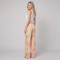 Mira marble print high waisted pants orange on model