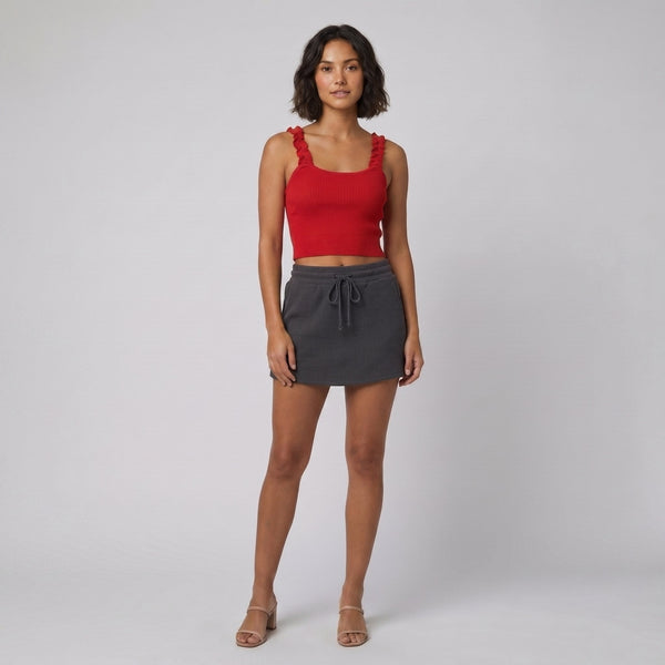 Mira red ribbed crop and charcoal skort set front on model