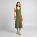 Svelte olive green deep V-neck ribbed bodycon midi dress on model